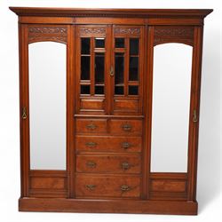 Late Victorian figured walnut combination wardrobe, projecting moulded and dentil cornice,...