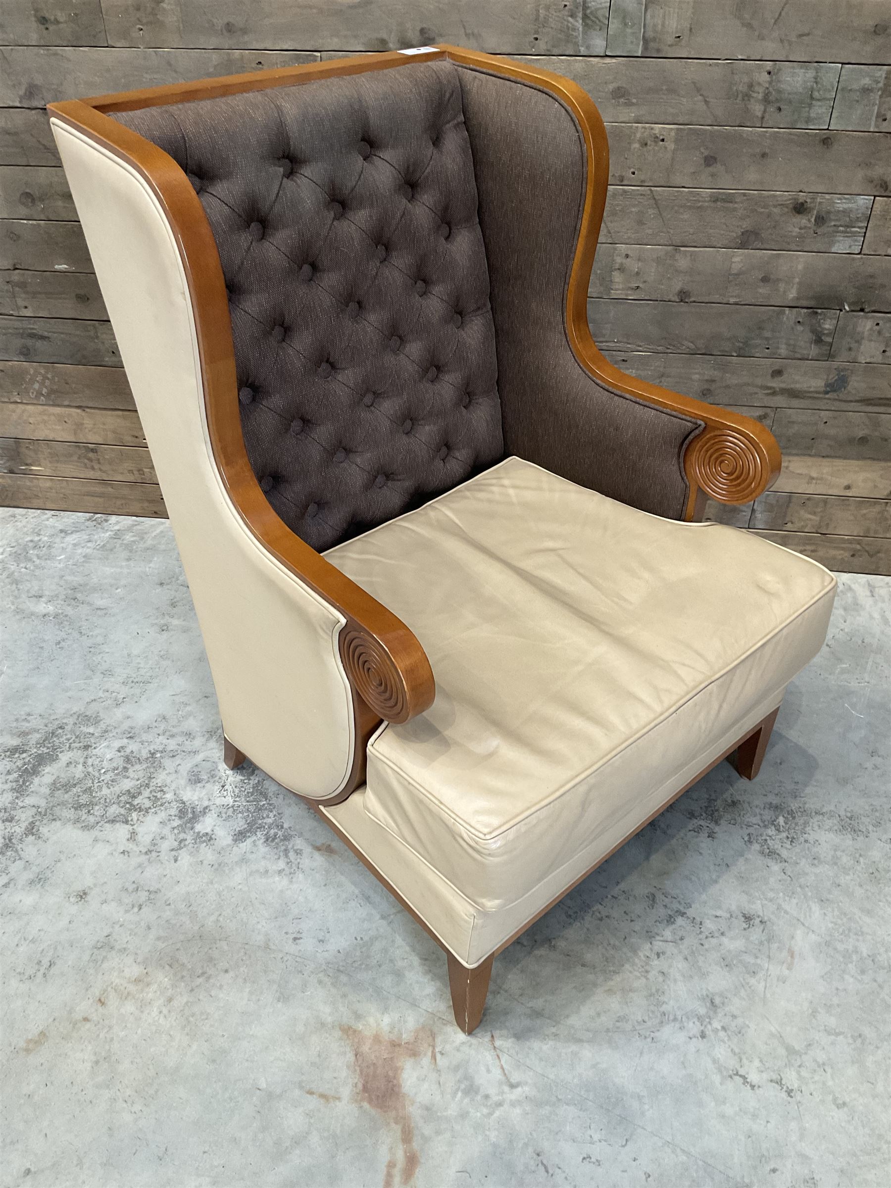 Walnut finish framed wing back armchair upholstered leather and buttoned fabric