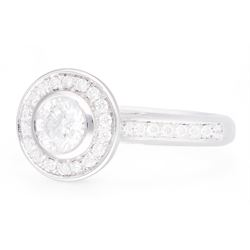 18ct white gold round brilliant cut diamond halo cluster ring, the principal diamond of approx 0.50 carat, with diamond surround and diamond set shoulders, hallmarked, total diamond weight approx 0.75 carat