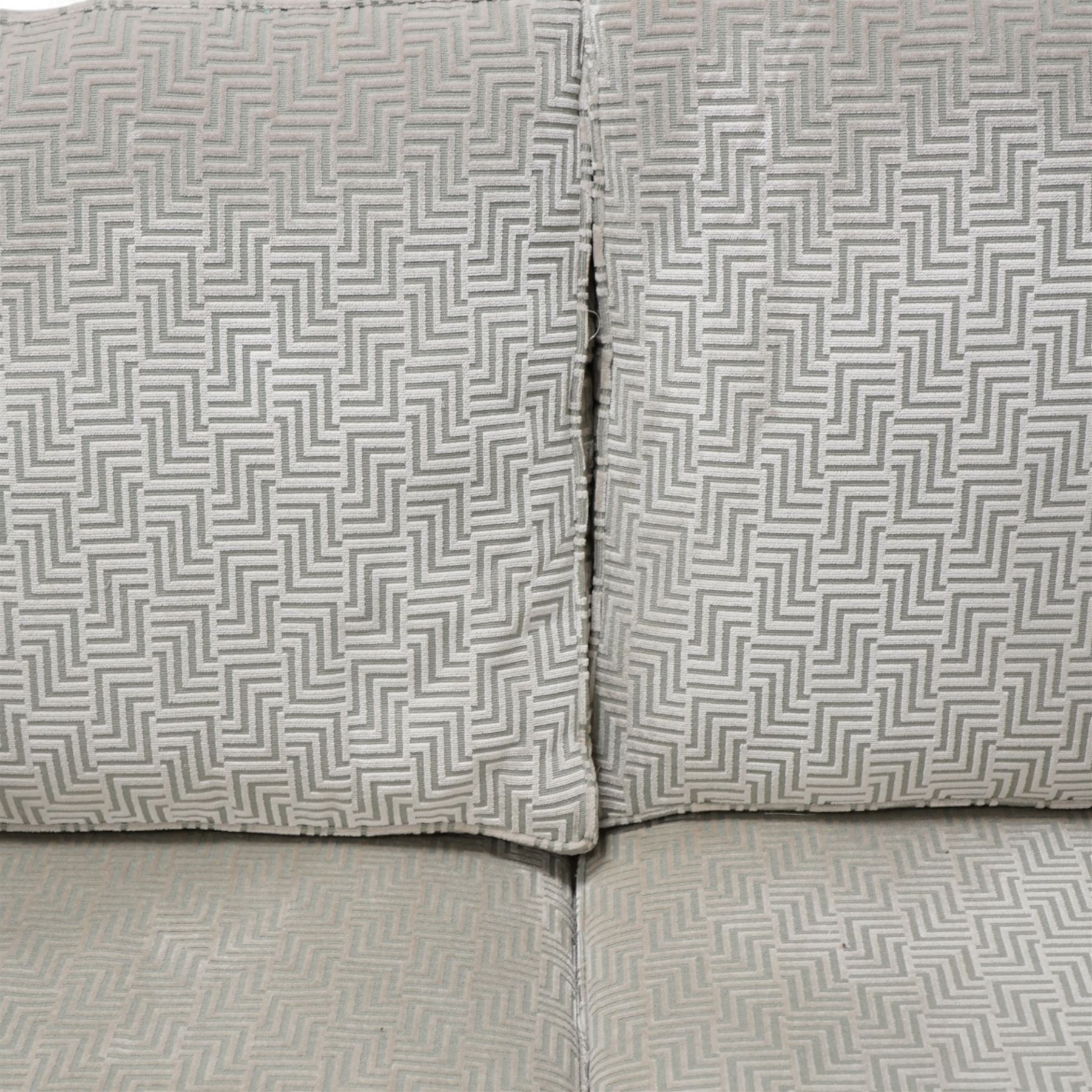 Duresta - traditional shape two seat sofa with rolled arms, upholstered in silvery-blue Greek key patterned fabric, with matching loose cushions, on castors