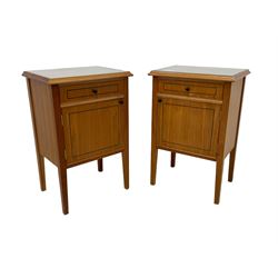 Pair of contemporary cherry wood bedside cupboards, inset glass top in moulded frame, fitted with single drawer over cupboard, on square tapering supports 