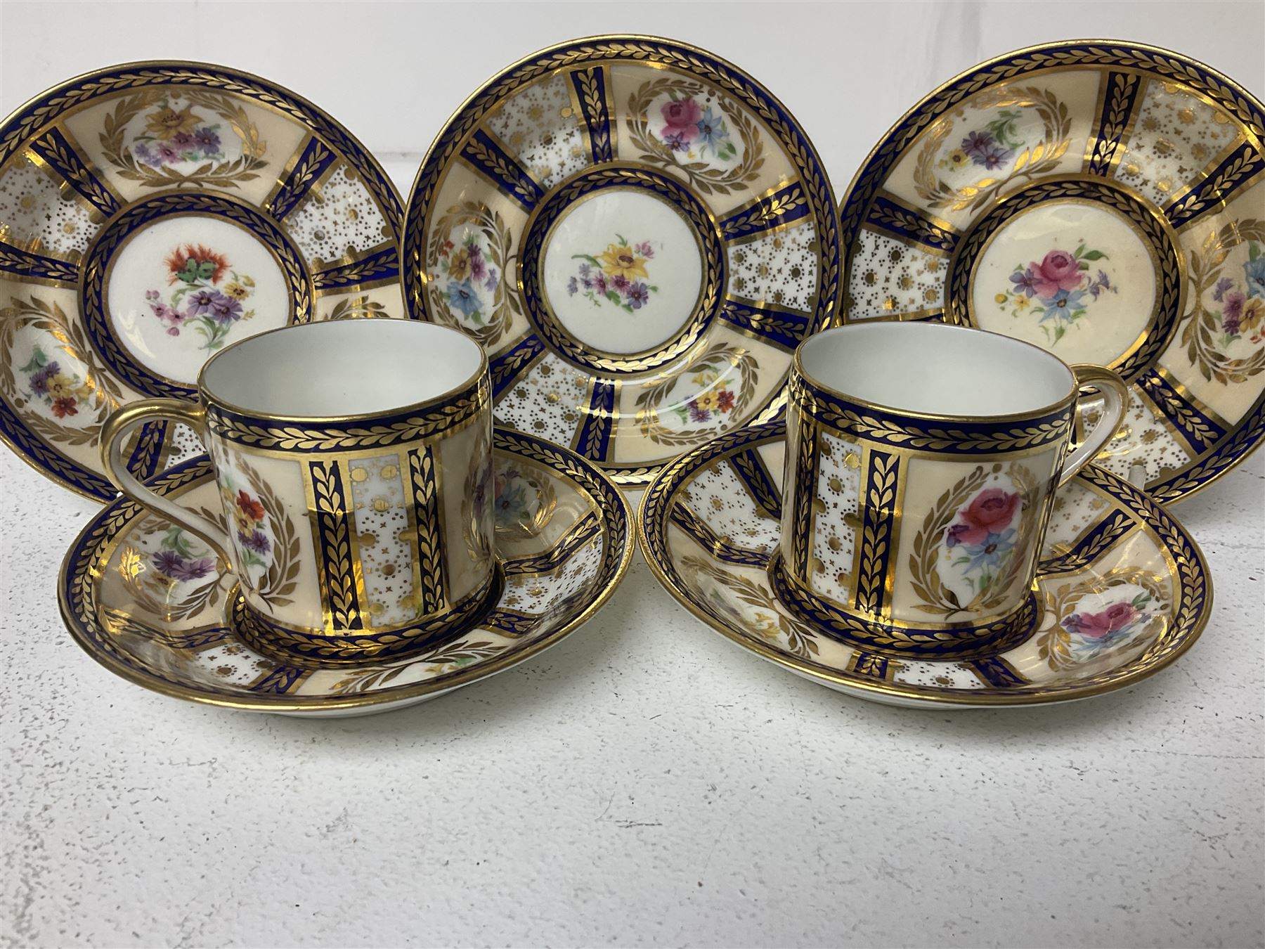 Paragon thee coffee cans and saucers, painted in gilt and colours with flowers, Paragon set of six coffee cups and saucers, 'Reproduction of Service accepted by Her Majesty Queen on her visit to the potteries, with three matching saucers