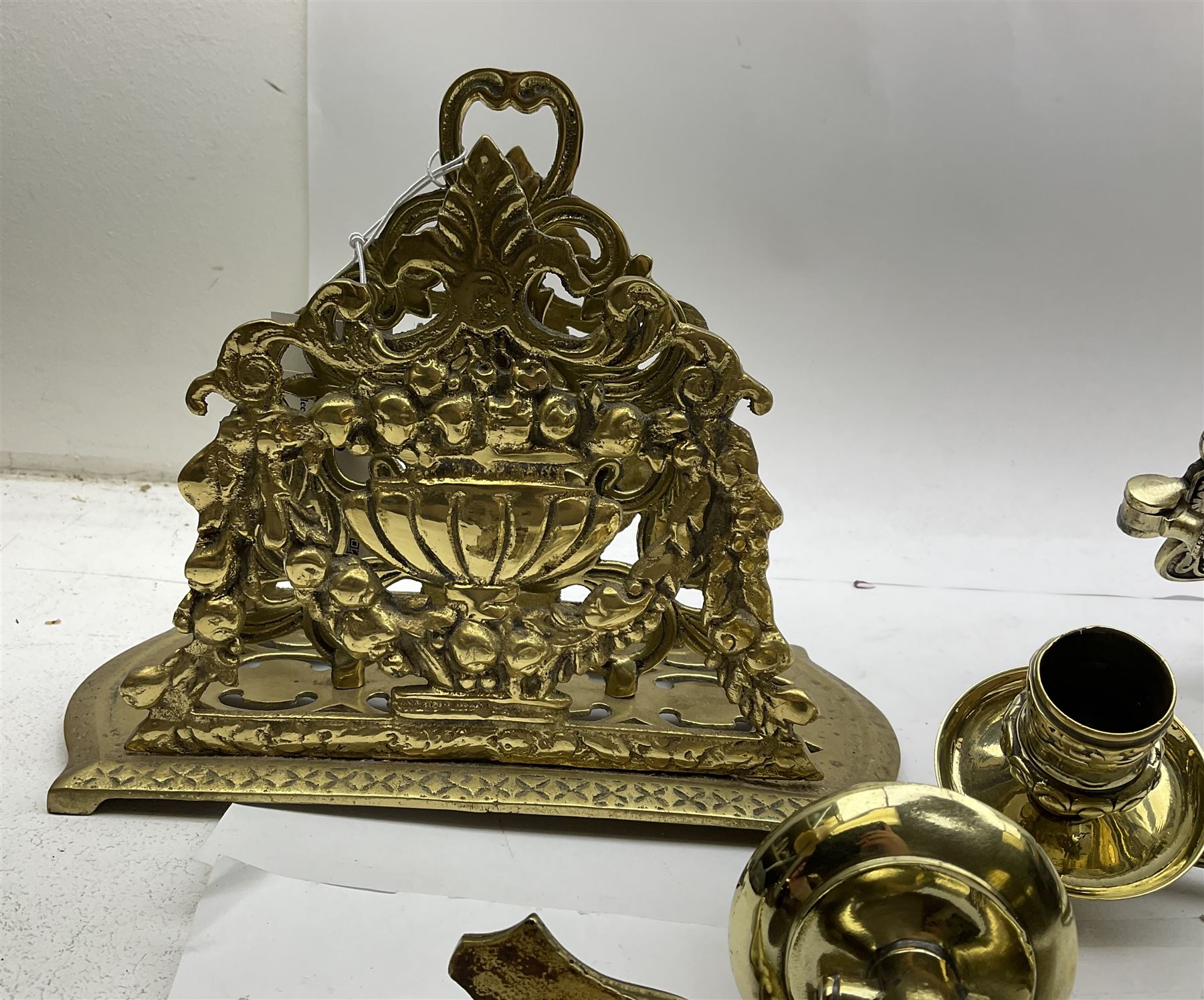 Brass letter rack, with two divisions, the pierced front and back modelled as a flowering urn hung with floral swags, H18cm, together with a pair of gilt metal extendable candle sconces, fully extended L50cm