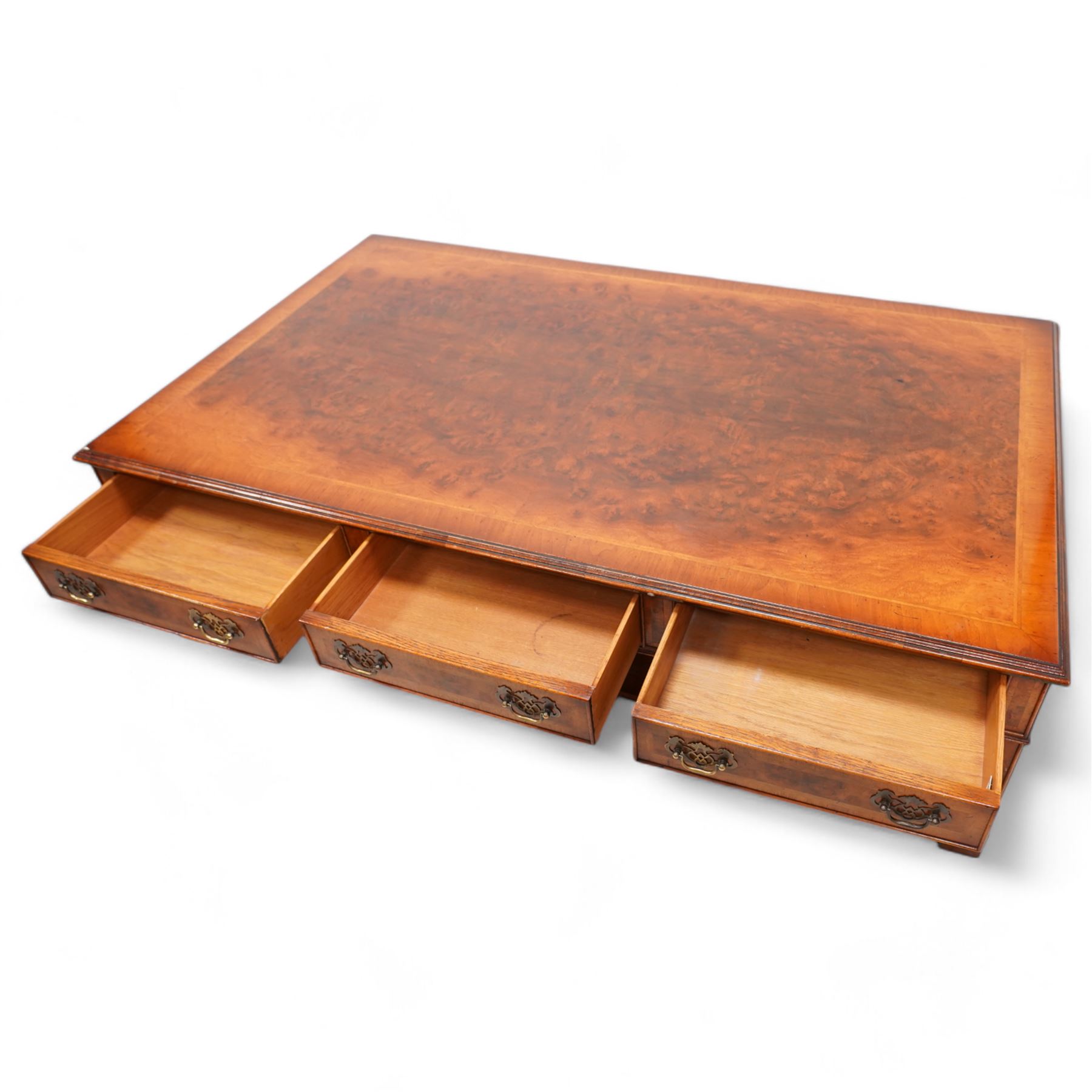 Siesta - Georgian design figured walnut coffee table, rectangular top with moulded edge, fitted with three cock-beaded and crossbanded drawers to each side, on square moulded supports united by a concave under-tier