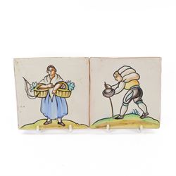 Pair of 20th century continental tin glazed tiles, of a man and a woman in traditional dress, H15cm