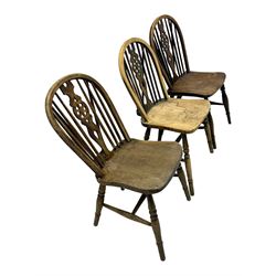 Mid-to-late 20th century set of six elm and beech Windsor dining chairs, hoop and stick back with pierced wheel splat, dished elm seat, on turned supports united by turned stretchers 