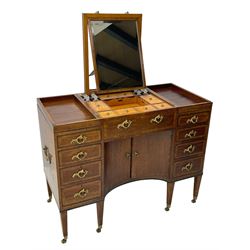 Late 19th century mahogany and satinwood dressing chest, the raised middle section hinges to reveal an interior fitted with lidded compartments, removable tray, single drawer and glass scent bottles, lift-up bevelled mirror with adjustable hinged mechanism, fitted with a further eight cock-beaded graduating drawers and curved kneehole with double cupboard, square tapering supports on brass cups and castors, inlaid throughout with checkered stringing, ornate Rococo cast gilt metal handles