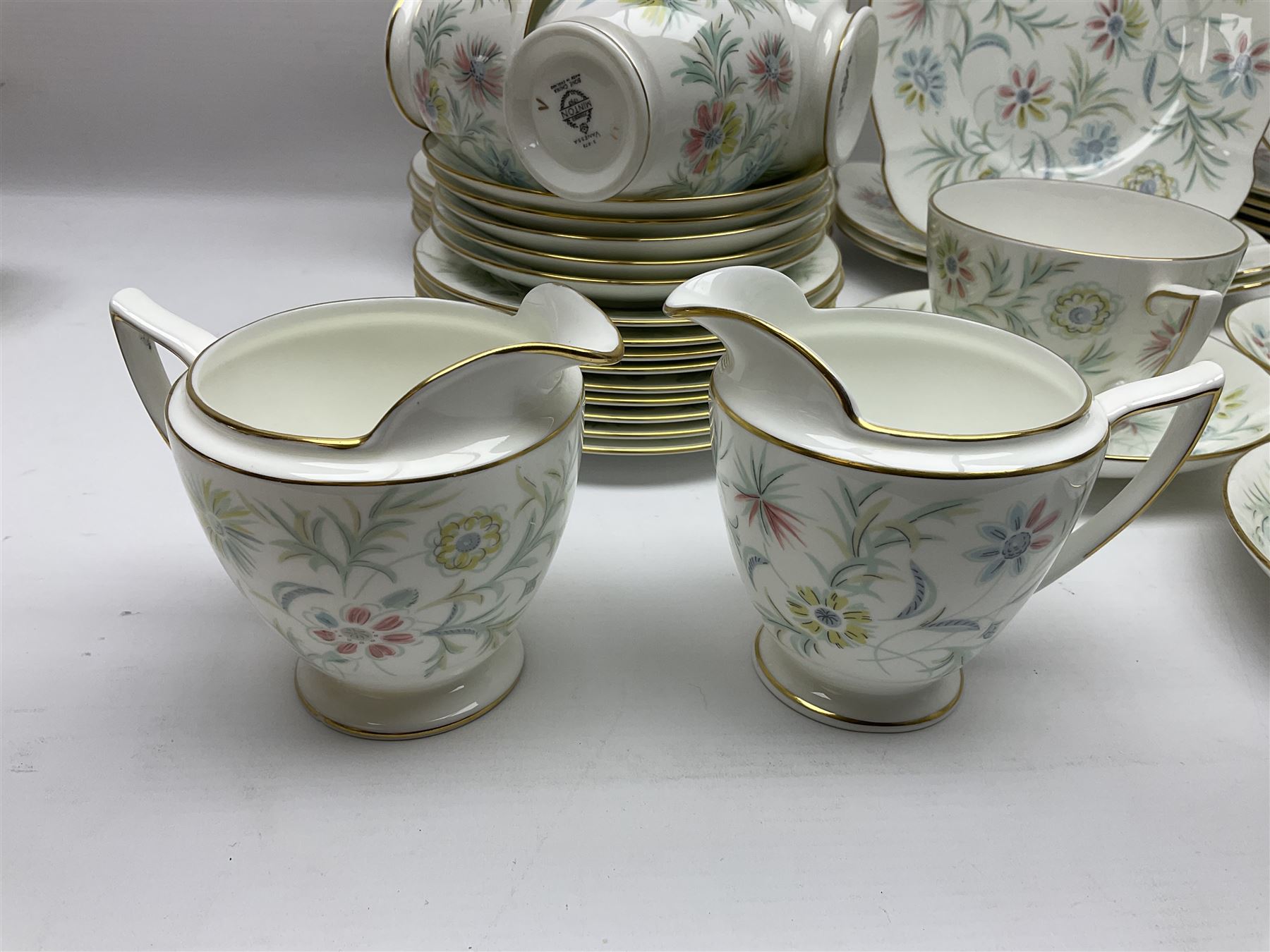 Minton Vanessa pattern part tea service, to include fifteen cups and saucers, open sucrier, milk jug, eighteen dessert plates, twelve side plates etc (70)