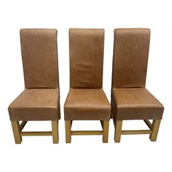 Set of six contemporary light oak dining chairs, each with high back and seat upholstered in pale tan leather, on square supports connected by H-stretcher