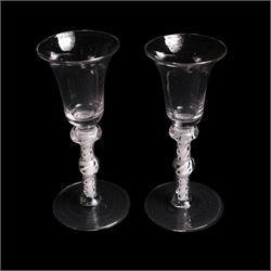 Pair of Georgian double-knopped opaque twist wine glasses,  with bell shaped bowls and opaque multi twist stems, H16cm