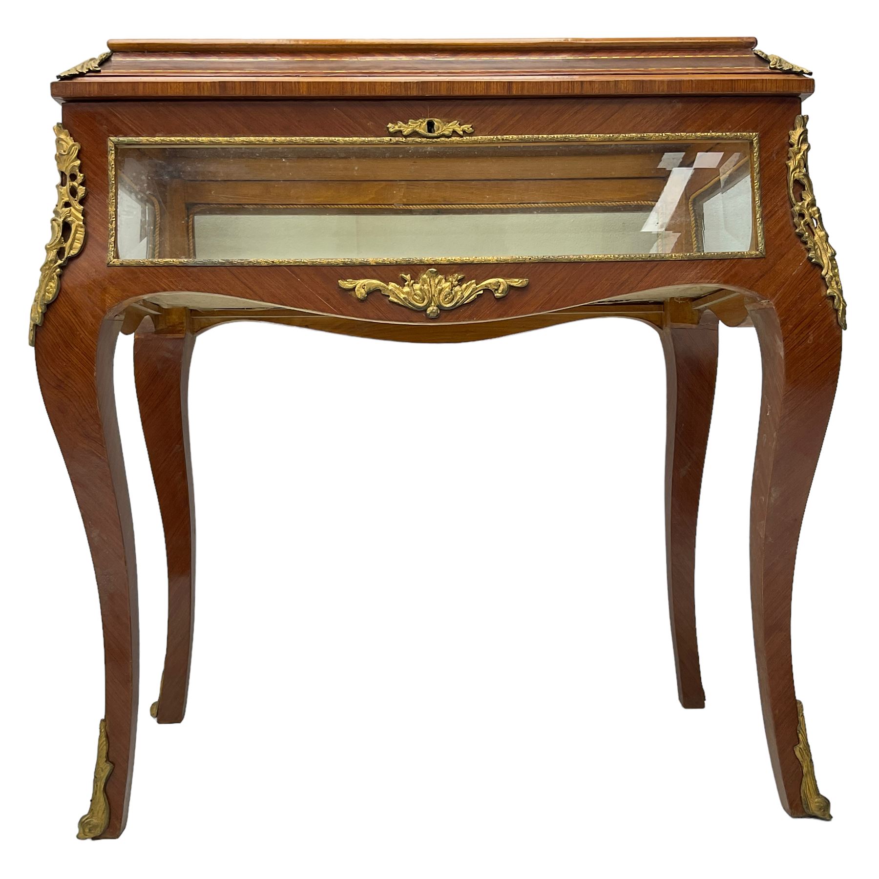 Mid-to-late 20th century French design Kingwood and walnut bijouterie cabinet, enclosed by cavetto moulded hinged lid with gilt metal foliage cast mounts and checkered stringing, on cabriole supports mounted by ornate cartouche castings and scrolled foliate terminal caps, lined in gold foliate pattern fabric and glazed with bevelled glass