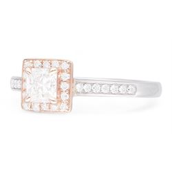 Platinum and 18ct rose gold diamond halo cluster ring, the principal princess cut diamond of 0.50 carat, with round brilliant cut diamond surround and diamond set shoulders, hallmarked, total diamond weight 0.68 carat