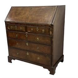 18th century walnut bureau, crossbanded and feather-banded rectangular top and fall-front, enclosing fitted interior with pigeonholes and correspondence drawers with bone handles, over two short and three long graduating drawers with moulded facias and original brass handles, on bracket feet