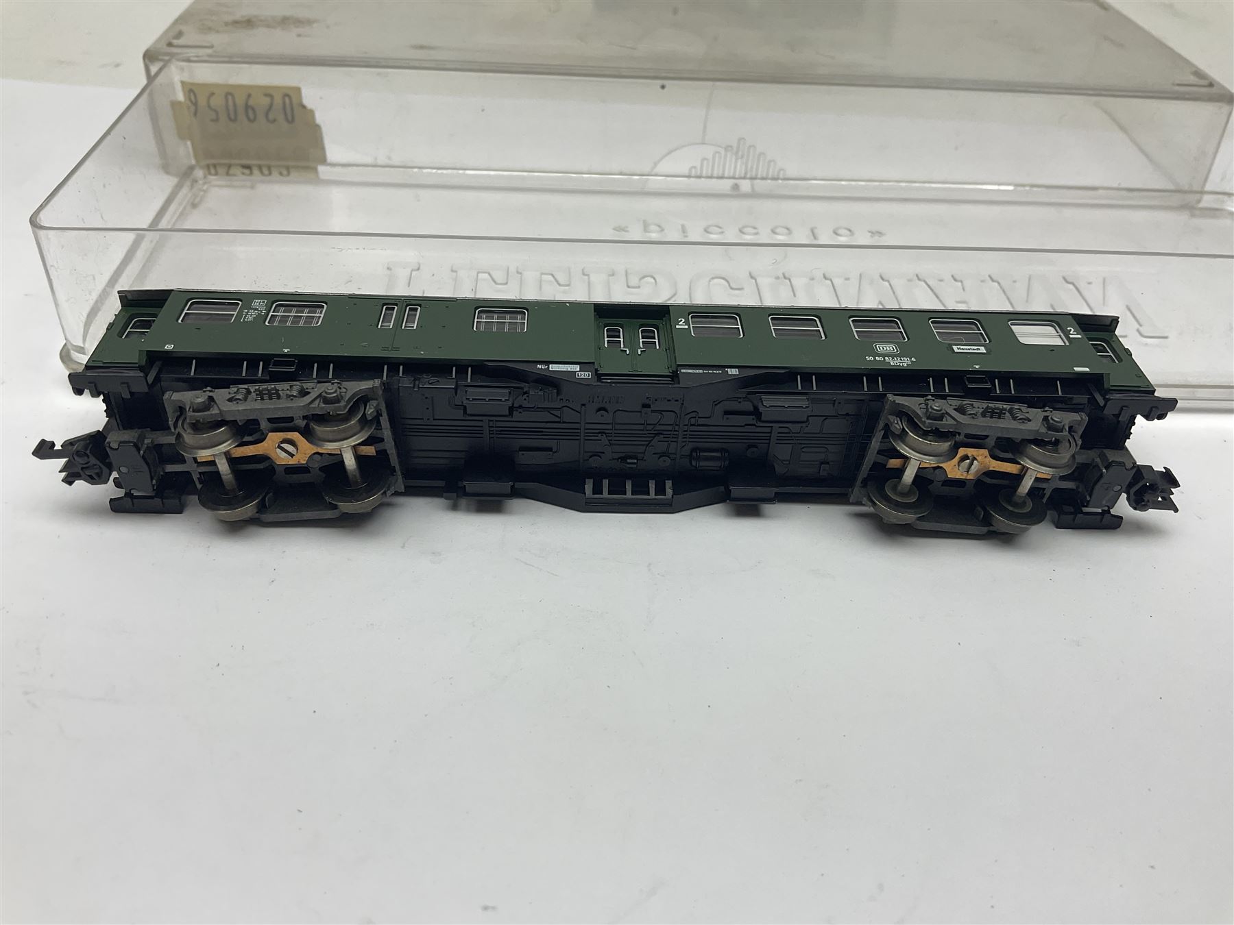 Fleischmann ‘N’ gauge ‘Piccolo’ - sixteen carriages, wagons and cars comprising nos. 8051, 8052, 8055, 8064, 8119K, 8127, 8128, 8129, 8202, 8211, 8224, 8240, 8281, 8301, 8500, 9372; along with Minitrix N503 Shock Van and 13576 6 ton Mineral Wagon; boxed and loose (18) 