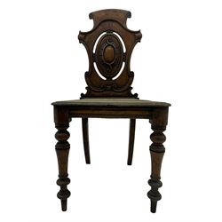 Victorian oak hall chair with scroll carved and pierced back, shaped seat and turned front supports