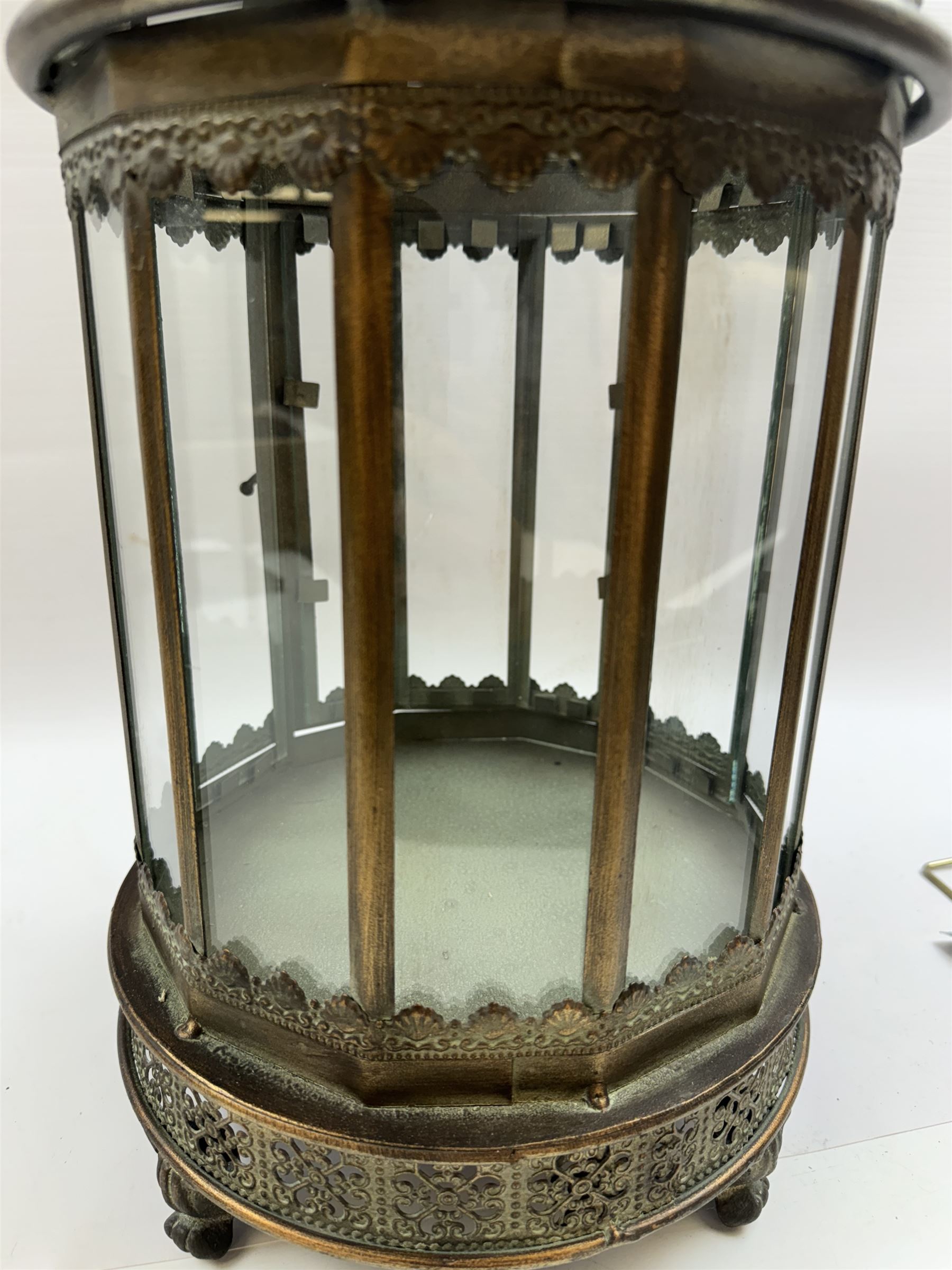 Pair of patinated brushed brass lanterns, of domed hexagonal form, with pierced gallery and swing handle, H63cm 


