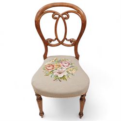 Set of five Victorian walnut balloon back dining chairs, interlaced C-scroll back over floral tapestry seat, on turned and fluted supports 