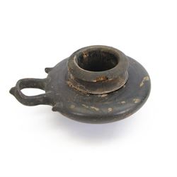 Etruscan terracotta oil lamp, with black glaze, flat loop handle and laurel leaf border, t...