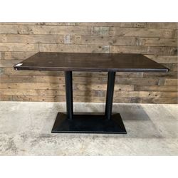 Two dark walnut rectangular console tables, on black metal bases