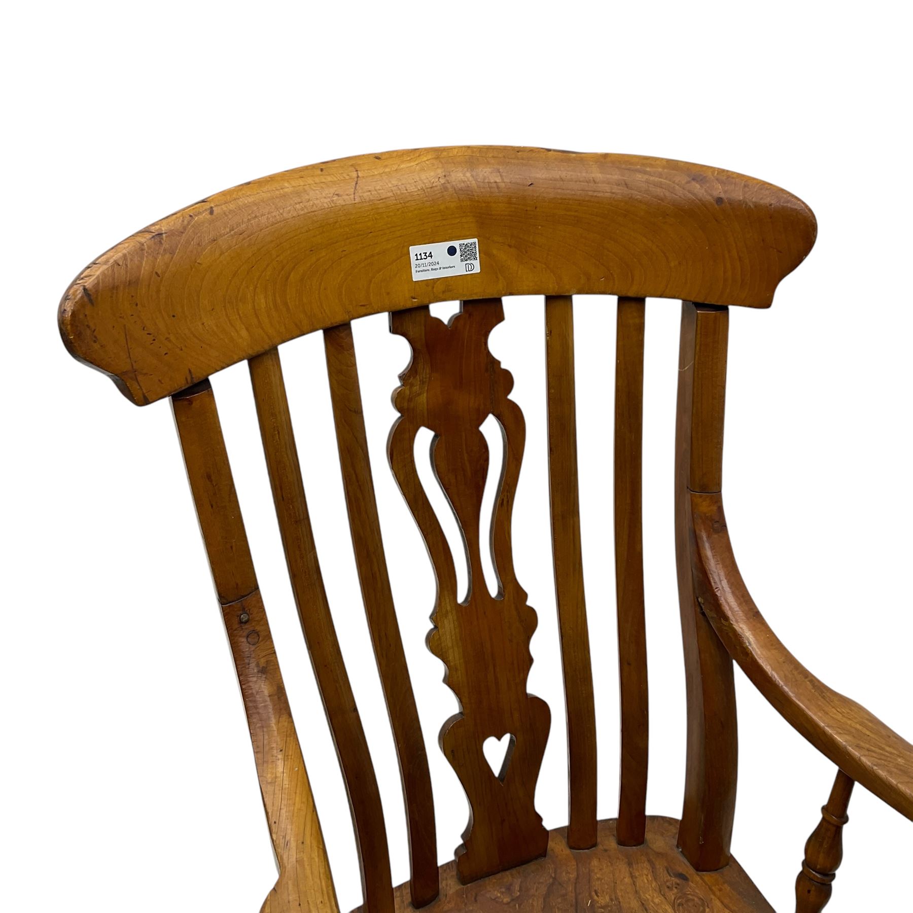 Late 19th century elm and ash comb-back Windsor chair, shaped back with pierced vase-shaped central splat and spindle supports, shaped saddle seat raised on turned supports united by H-stretcher