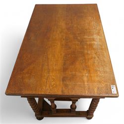 19th century oak desk, rectangular top over two drawers and cupboard, on spiral turned supports and turned bun feet