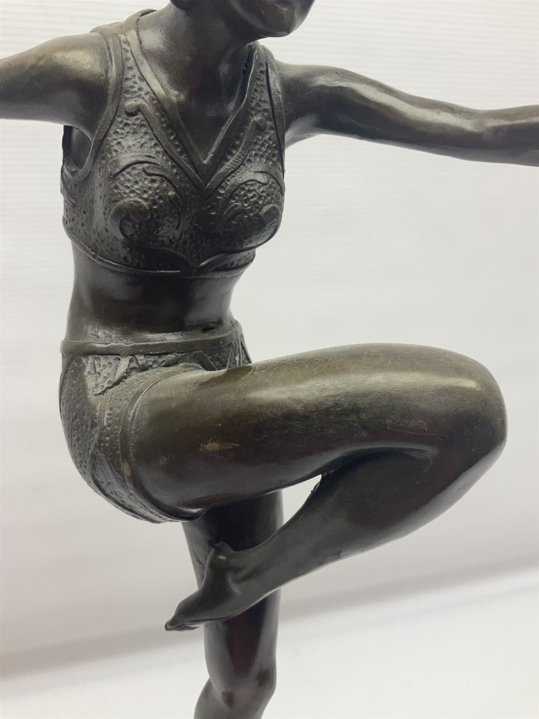 Art Deco style bronze, after Philipp, modelled as a dancer with her arms outstretched and one leg raised, on a veined marble tapering base signed Philipp and with foundry seal, H58cm