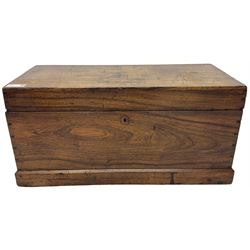 19th century teak blanket chest, hinged lid over plain front, fitted with brass carrying handles on plinth base 