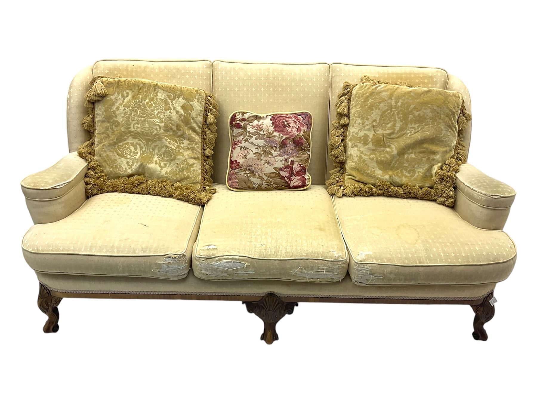 Late 20th century mahogany framed three seat sofa, upholstered in cream fabric with repeating cross pattern, raised on cabriole supports (W192cm, D98cm, H89cm); matching armchair in light pink fabric (W92cm, D98cm, H89cm) 