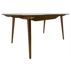 Ercol - light elm and beech 'Slide Leg Expanding Dining Table (444)', rectangular top with rounded corners, raised on tapered splayed supports, with two additional leaves