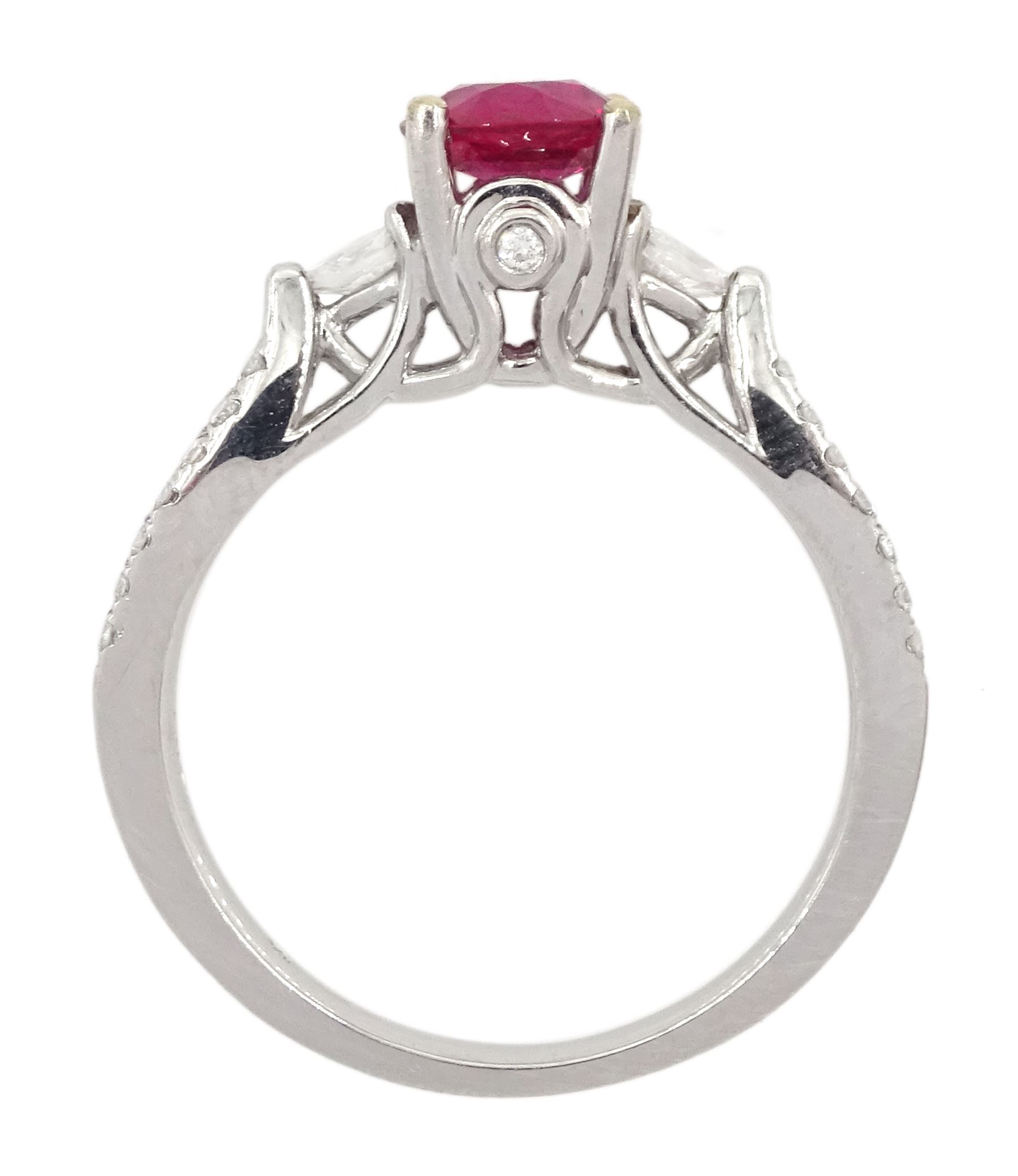 18ct white gold three stone round cut ruby and pear cut diamond ring, with diamond set gallery and two row diamond set shoulders, hallmarked, ruby approx 0.85 carat