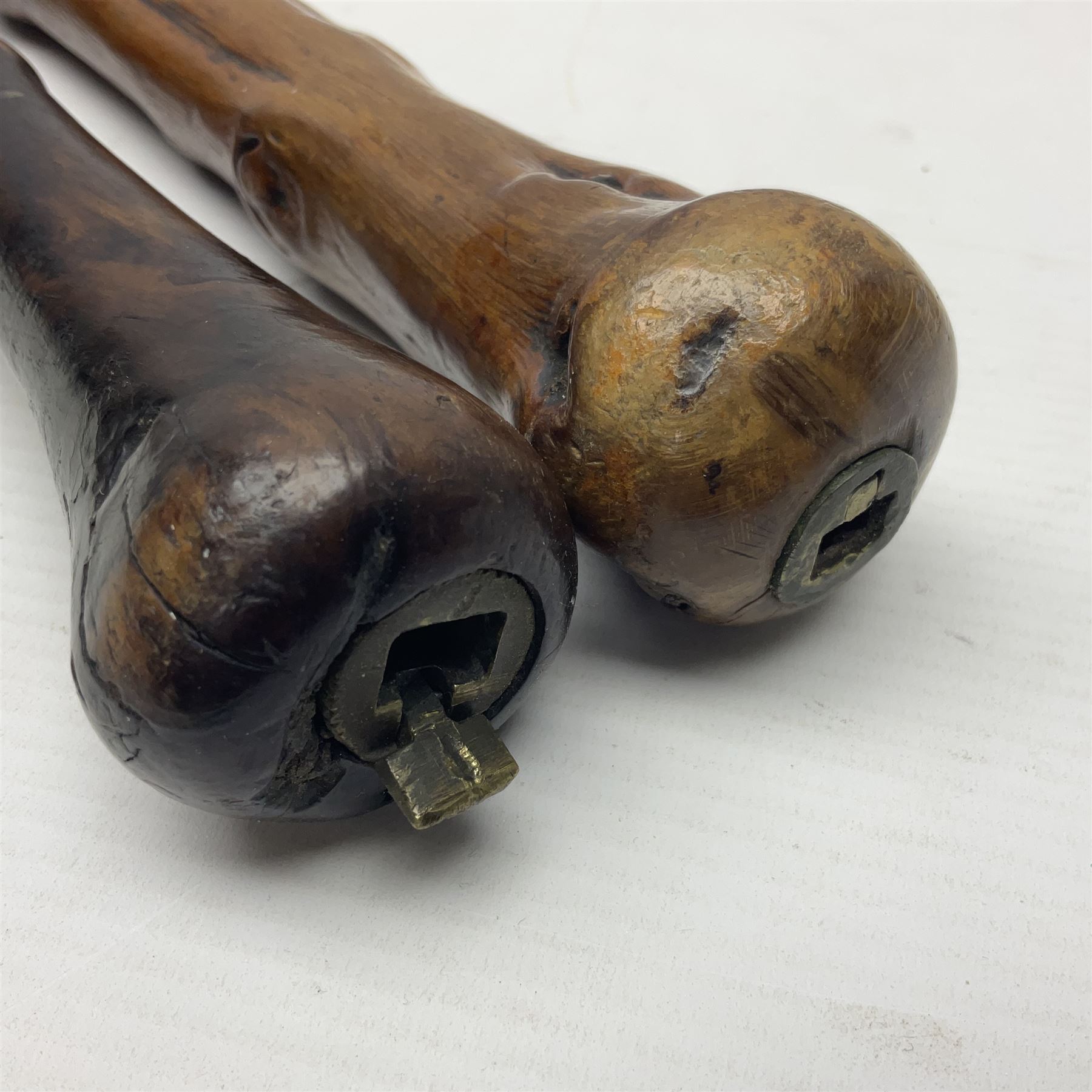 Two wooden walking sticks, both with comparts that would have housed horse measures, H88cm