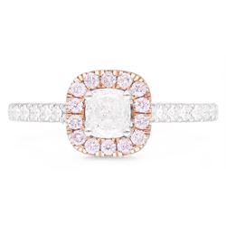 Platinum and 18ct rose gold diamond halo cluster ring, the principal white cushion cut diamond of 0.51 carat, with GIA report, colour G, clarity VS2, with round brilliant cut pink diamond surround of approx 0.20 carat, and white diamond set shoulders, hallmarked