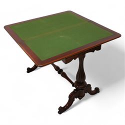 Victorian figured mahogany card table, rectangular swivel and fold-over top with rounded corners and baize lined interior, shaped apron over turned and lobe carved end supports, terminating to scroll and cartouche carved splayed supports united by swell-turned stretcher