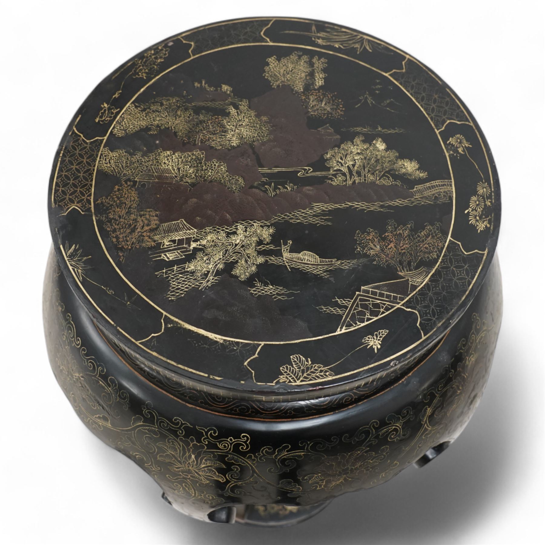 Chinese design black lacquered jardinière stand, circular bulbous form, the top decorated with traditional Chinese pagoda scene with fisherman, five shaped supports on circular base, scrolling decoration 