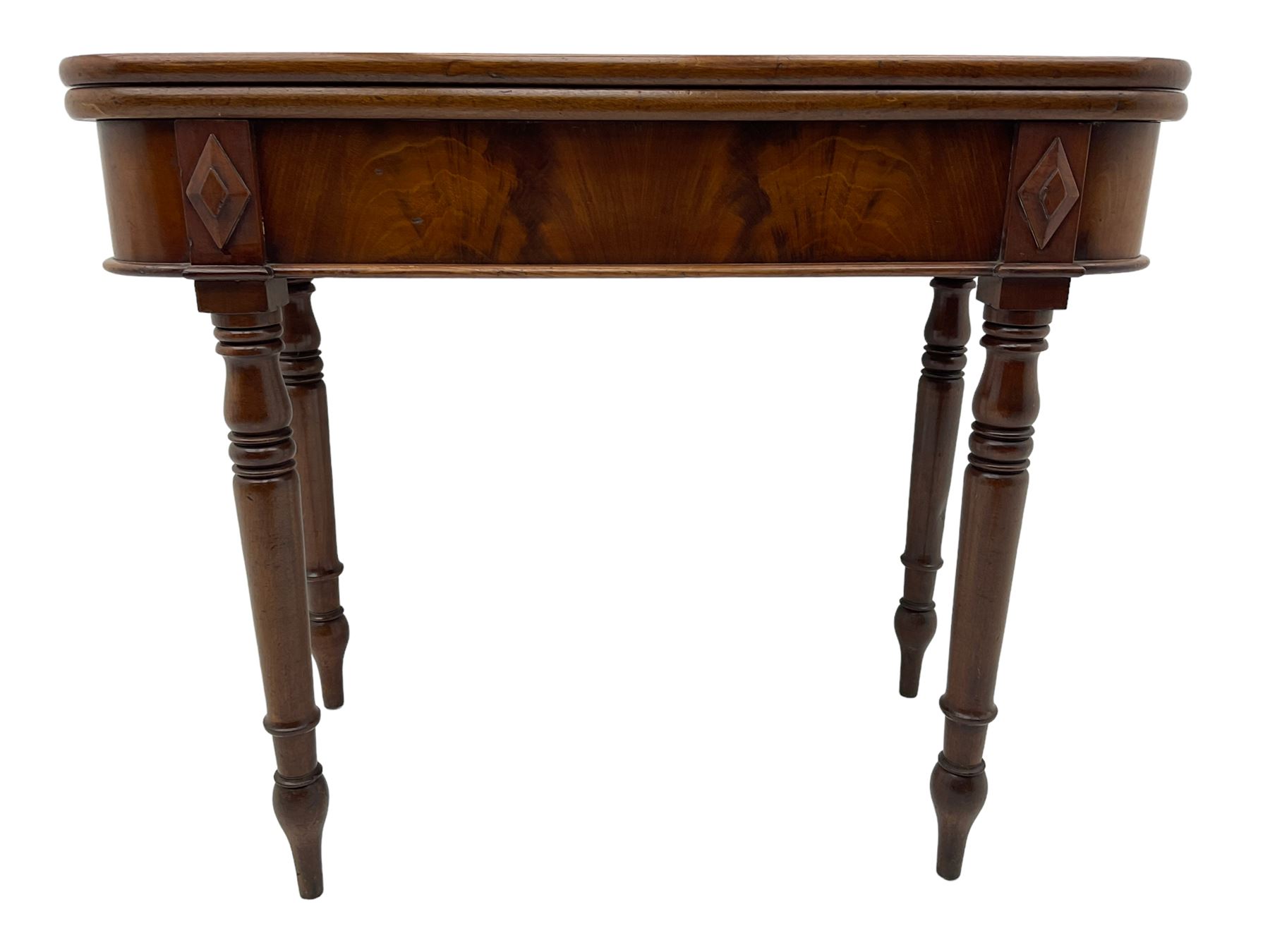 19th century mahogany tea table, fold-over swivel action rectangular top with rounded corners, figured frieze with stepped lozenge mounts, on turned supports