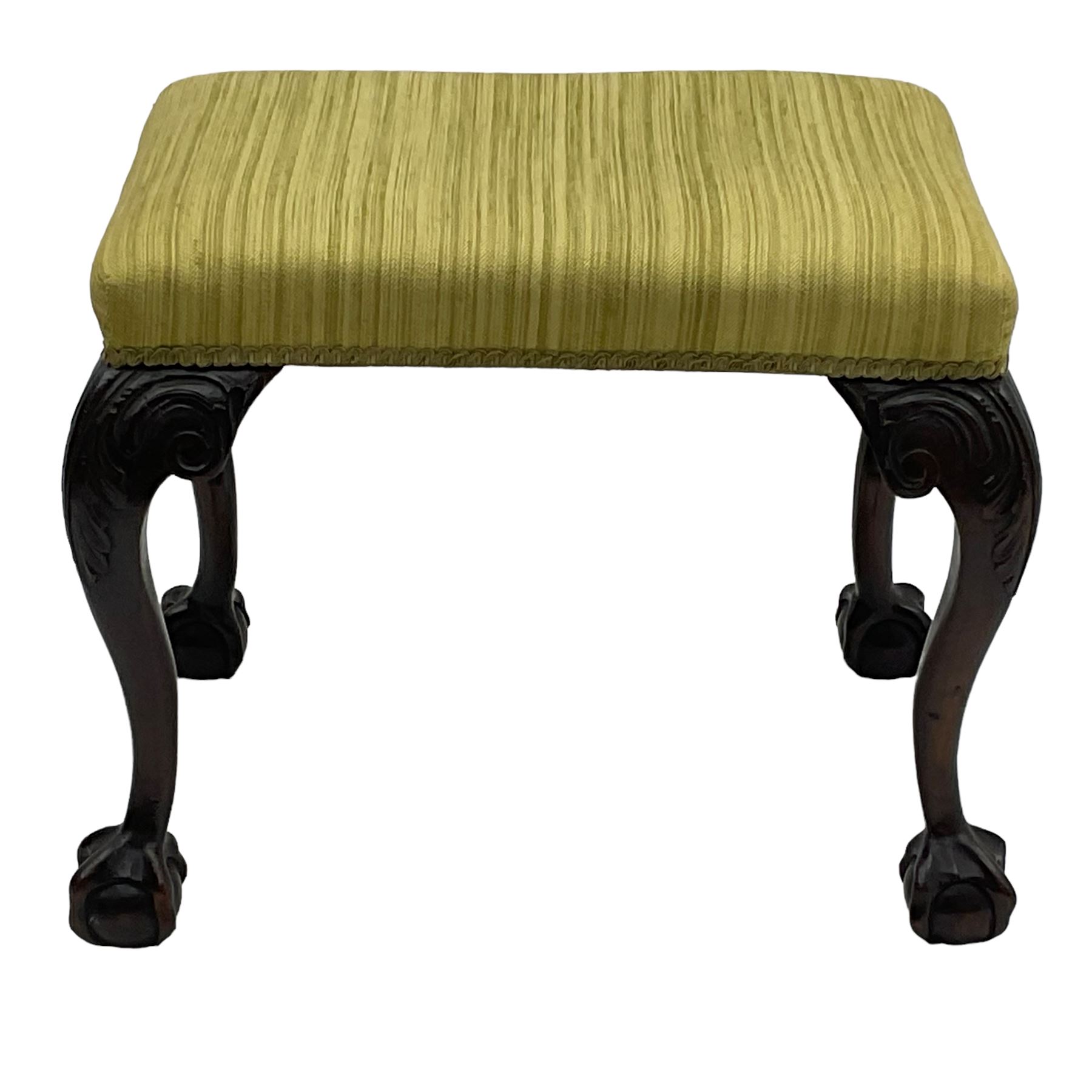 Georgian design mahogany cabriole stool, rectangular top upholstered in green fabric, on scrolled acanthus leaf carved cabriole supports with ball and claw feet