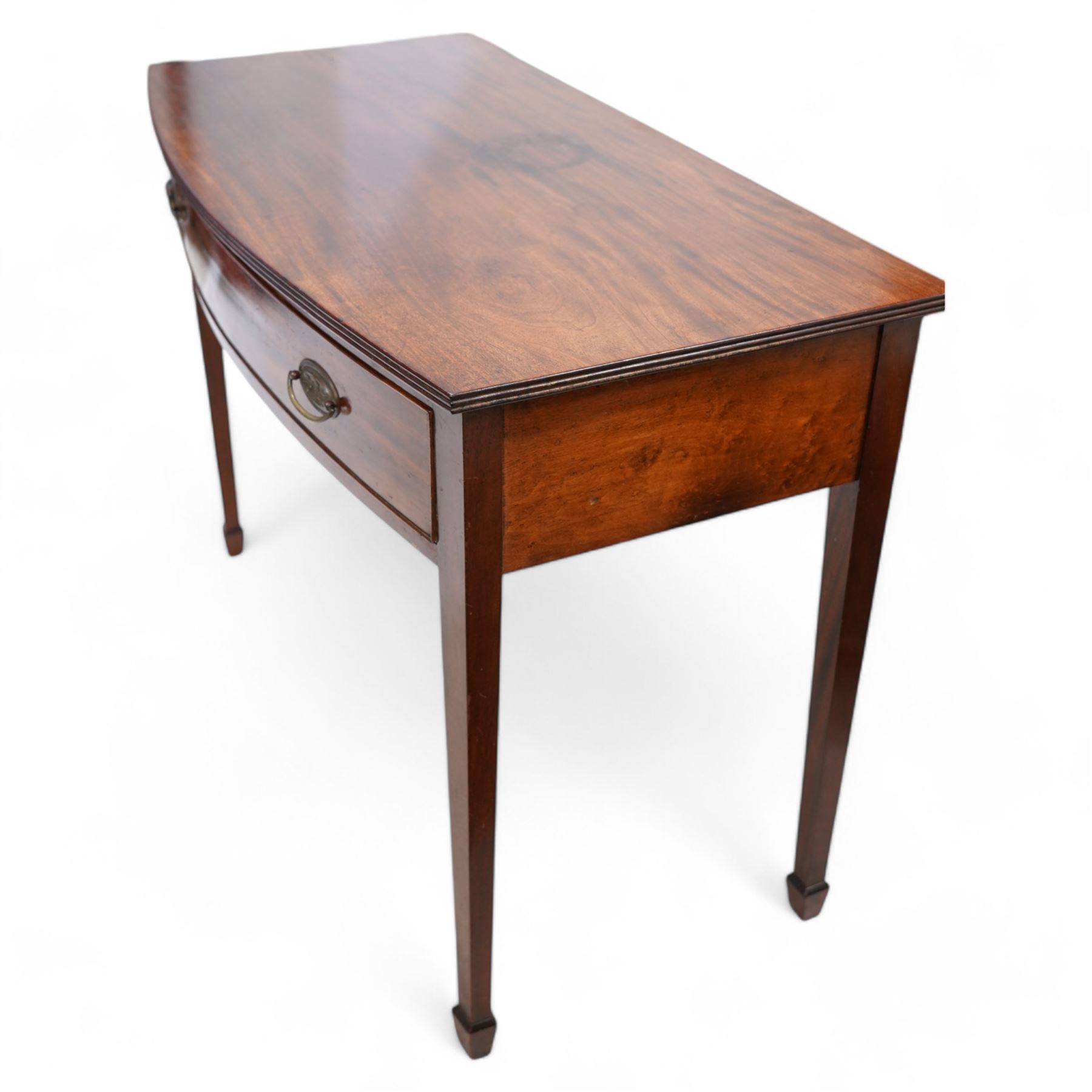 19th century mahogany bow-fronted side table, reeded top over single drawer, on square tapering supports with spade feet