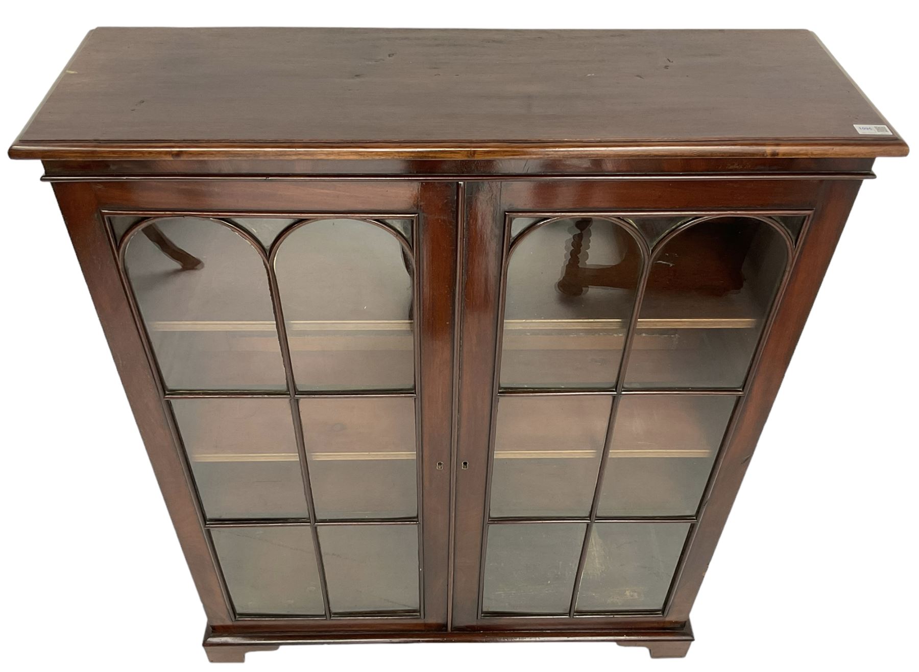 Early 20th century mahogany bookcase, fitted with two astragal glazed doors enclosing three adjustable shelves