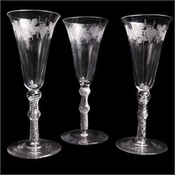 Set of three Georgian style engraved double-knopped multi air twist, with bell shaped bowls with vine engraving, to conical feet, H19cm