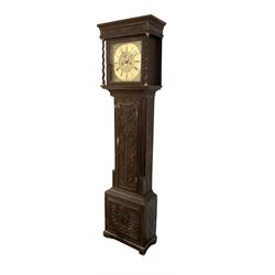 8-day - profusely carved oak longcase, with a flat top and square hood door beneath, door flanked by barley twist columns with brass capitals, trunk with reeded quarter columns and wavy topped door, on a carved plinth raised on bracket feet, brass dial with an engraved and matted dial centre, penny moon and date aperture, chapter ring inscribed “John Stancliffe” with Roman numerals and five-minute Arabic's, rack striking movement with a recoil anchor escapement. With pendulum and weights.