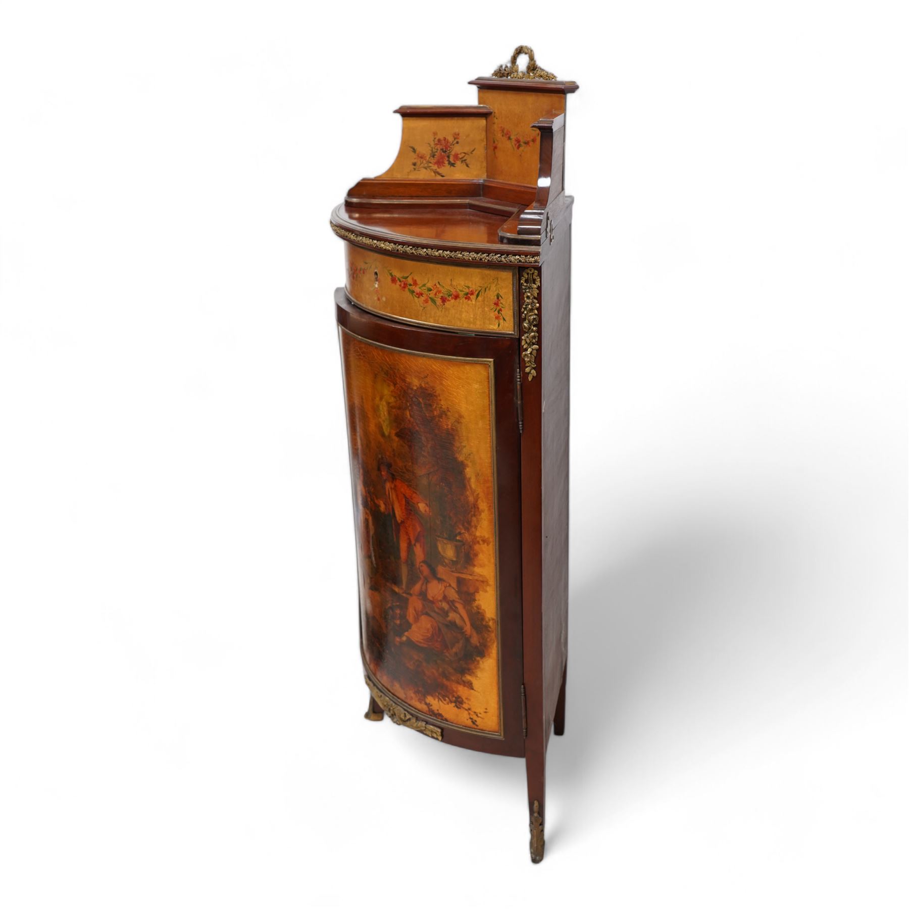 Mid-to-late 20th century mahogany and gilt metal mounted corner cupboard, raised back with floral decoration surmounted by laurel leaf wreath, single hinged drawer decorated with floral festoons, enclosed by single door with Vernis Martin design panel, on out splayed feet with foliate mounts 