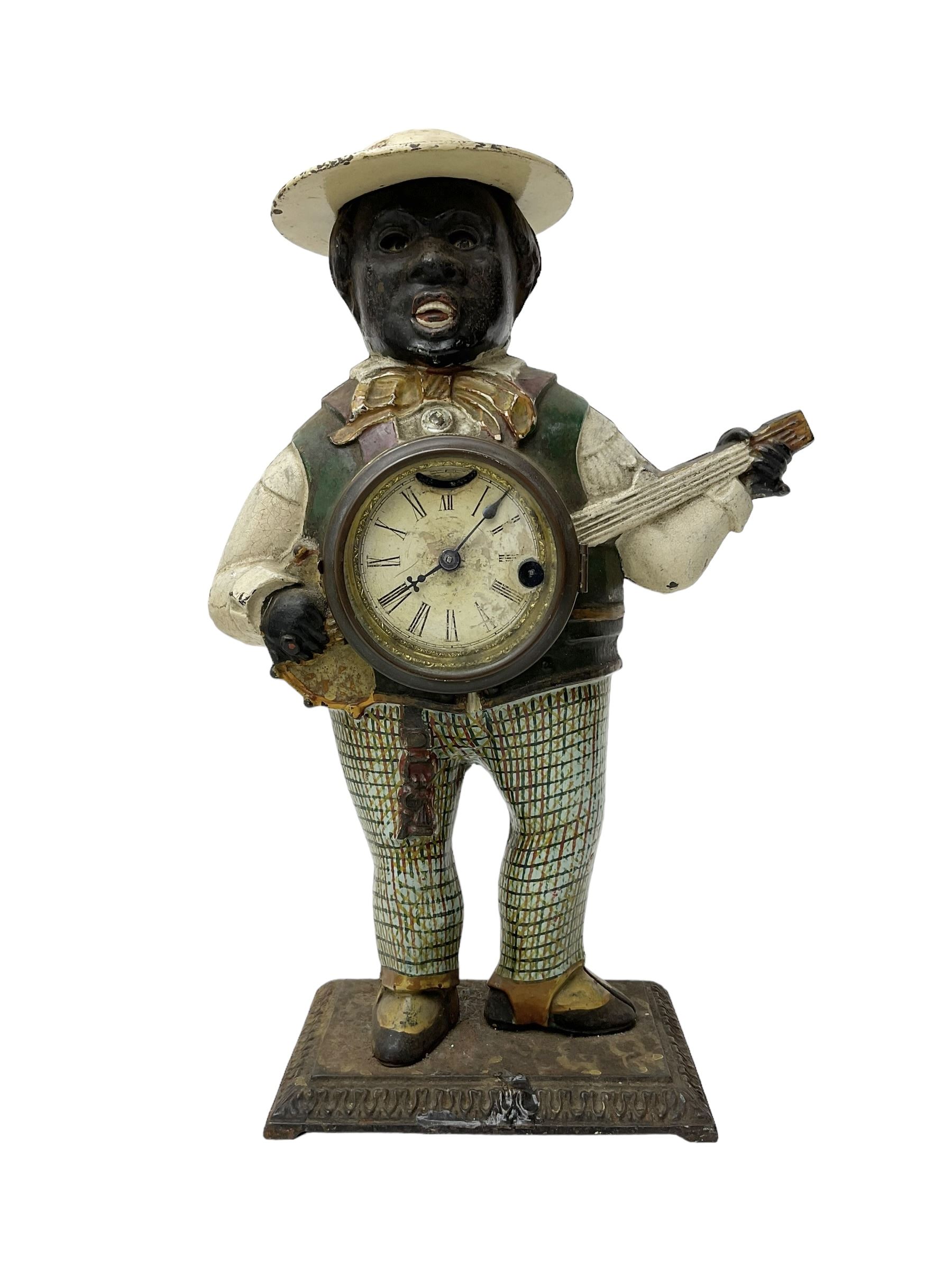 American  - Blinking-eye cast iron 30-hour banjo clock with a key wound spring driven movement and pin pallet escapement, dial bezel stamped 