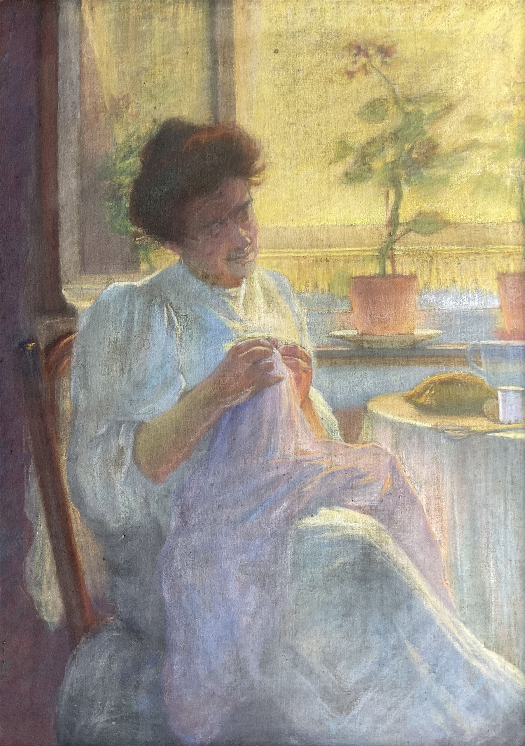 English School (Early 20th century): Lady Seated by a Window, pastel on linen canvas possibly signed lower left 91cm x 65cm