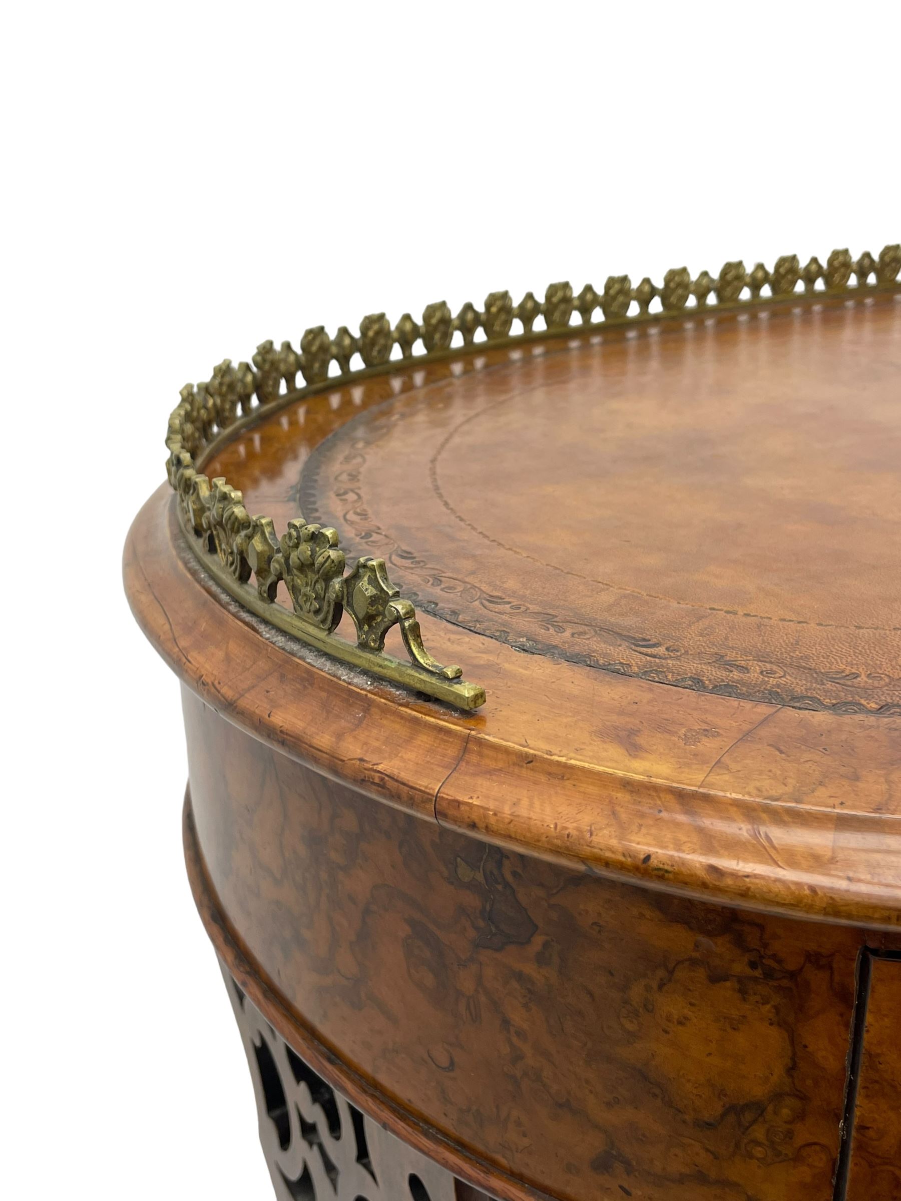 Victorian walnut kidney-shaped writing desk, moulded top with floral cast brass gallery and inset leather writing surface, fitted with three frieze drawers with turned handles, shaped and pierced end supports on raised platforms terminating to splayed feet, united by twist turned and lobe carved stretcher, brass and ceramic castors 