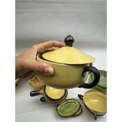 French green and yellow glazed tea and dinner wares by Etienne Noel, including milk jugs, teacups, side plates, bowls etc (43)