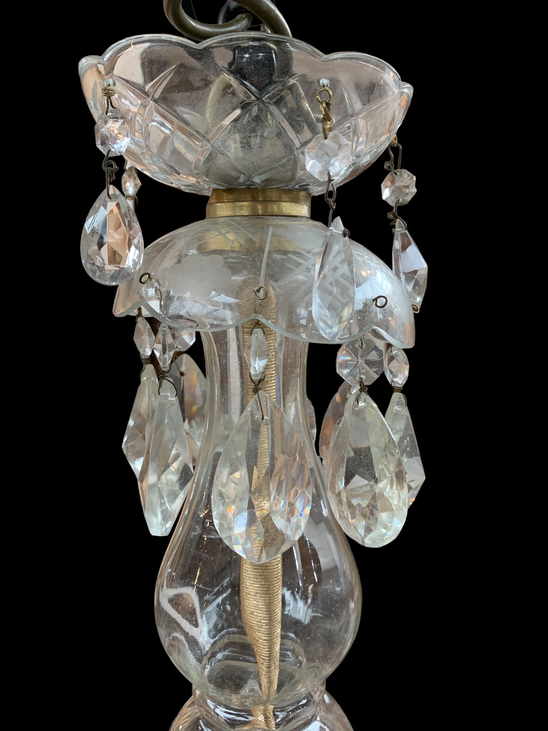 Italian style eight branch glass chandelier, with baluster stem, eight barley twist scroll arms interspersed by seven clear blown glass leaves, petal edged drip pans and hung with faceted glass bead swags and drops, H94cm x W85cm approx.