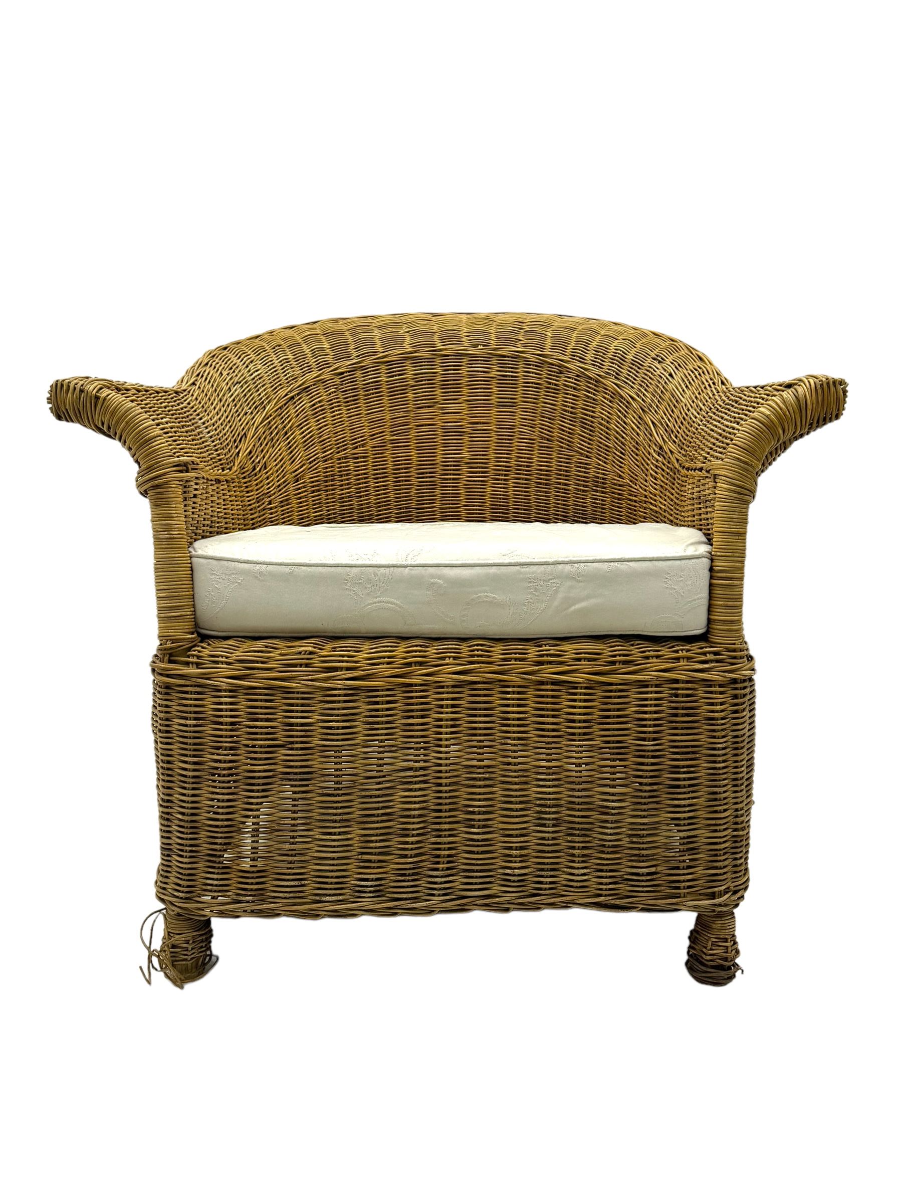 Rattan armchair and ottoman set, pair of armchairs featuring rounded backrests with wide armrests, woven wicker frame with weaving and upholstered seat cushions in off-white fabric with flowing floral pattern (W83 D80 H78cm); matching round ottoman with upholstered cushion on square wooden feet (W65 D65 H37cm)