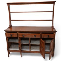 Acornman - oak dresser, raised two heights plate rack over three drawers and panelled cupboards, fitted with wrought metal fittings and handles, carved with acorn signature, by Alan Grainger, Brandsby, York 