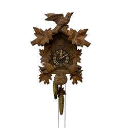 German 1960's cuckoo clock with automata - traditional styled case and dial with a cuckoo sounding the hours and half-hours, twin chain driven movement and automata feature of two carved cuckoos to the front of the case simultaneously moving as the hours are struck. With weights and pendulum.  