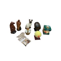 Six whisky miniatures in novelty decanters, together with Beswick cat, and nine Robertsons Golly badges